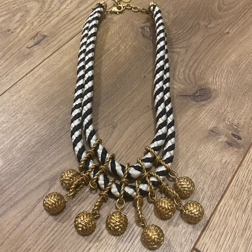 Braided black and white necklace with gold detail